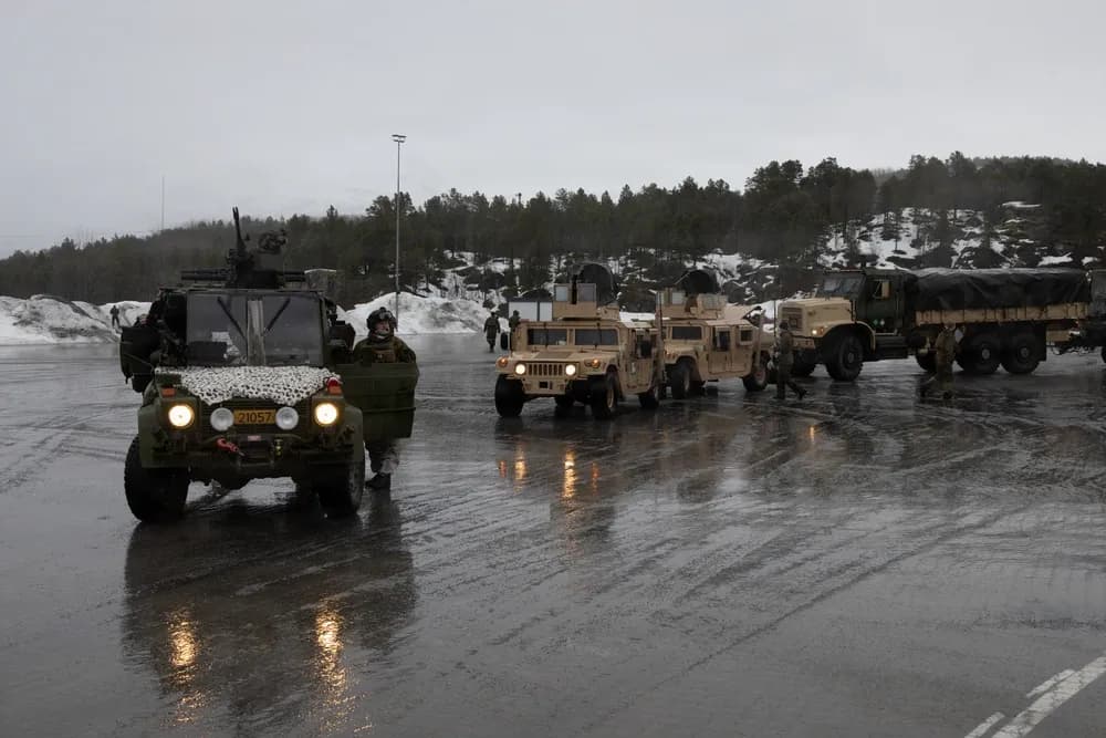 Military Humvee Convoy Driving on Wet Road In Winter